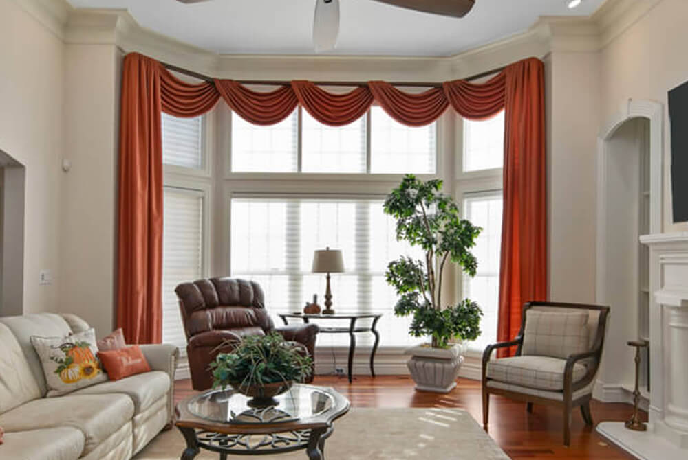 classic red custom drapery with diffused light sheer